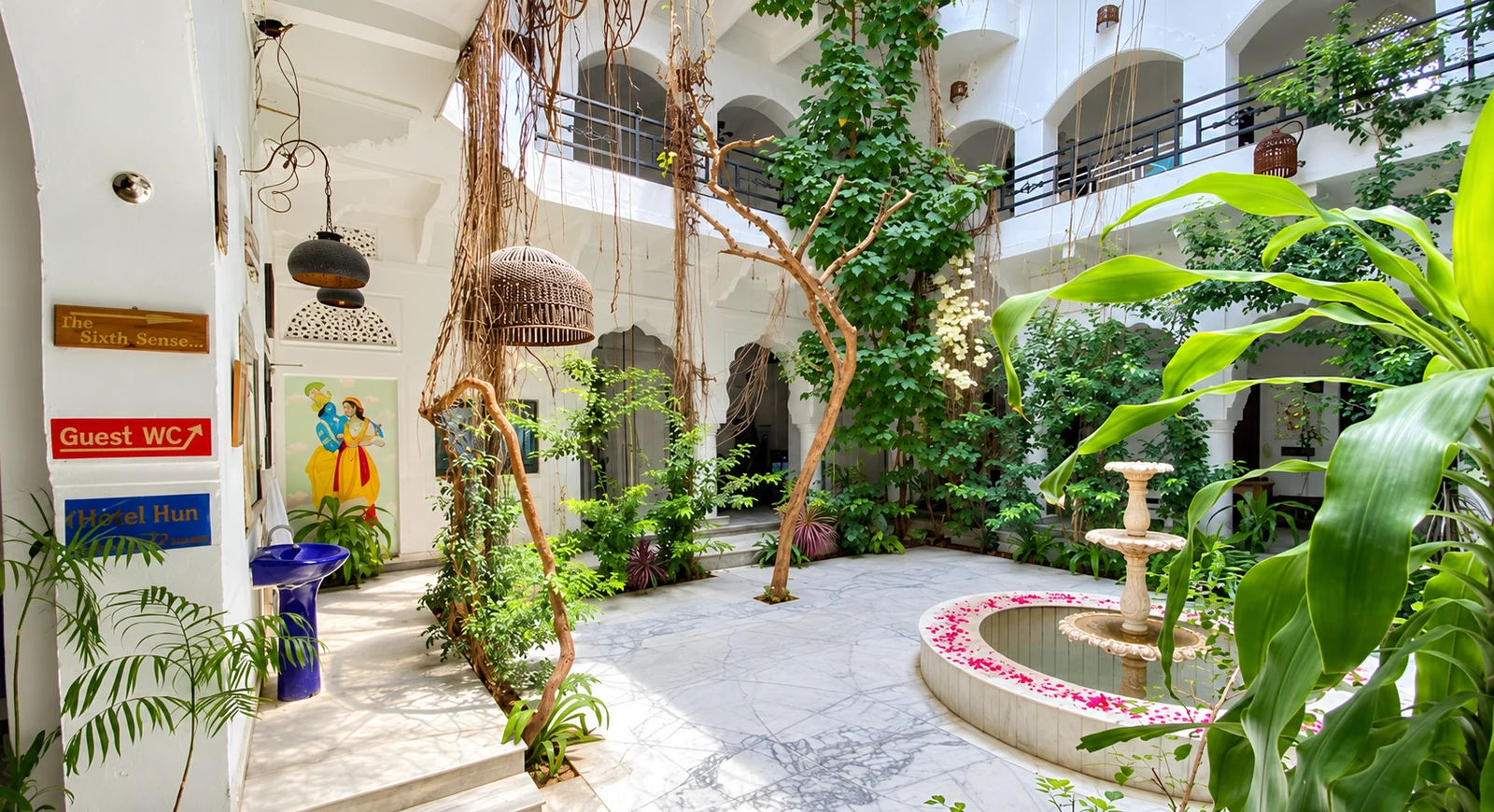 Leafy interior courtyard at Inn Seventh Heaven in Pushkar