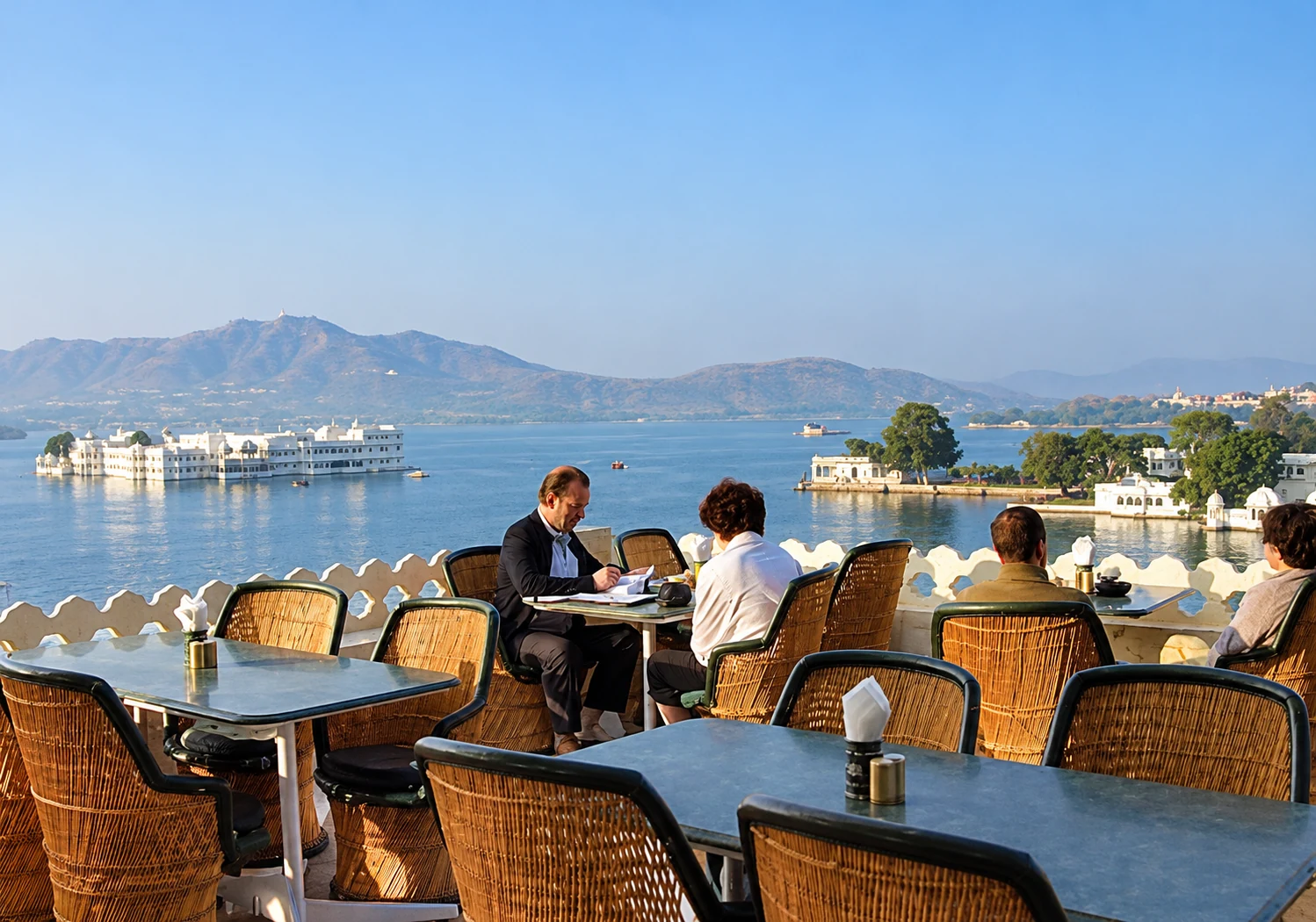 Rooftop dining with a lake view at Jaiwana Haveli in Udaipur