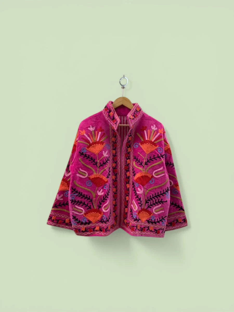 Colourful embroidered clothing from Palianda’s textile collection.